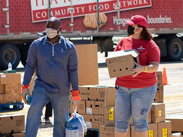 Empower associates work at a food donation site