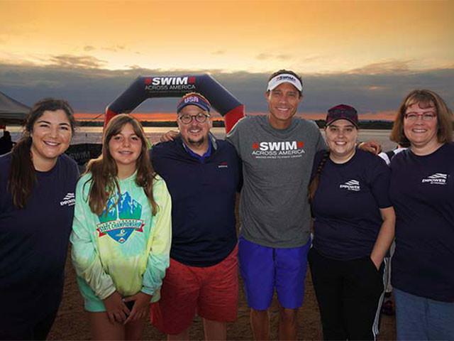 Empower associates pose at Swim across America event